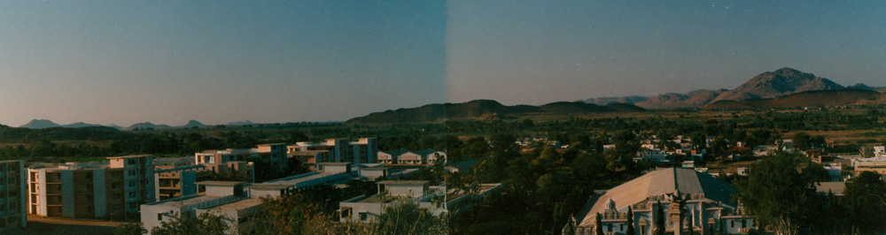 View of ashram in  landscape - hills, evening, 1984